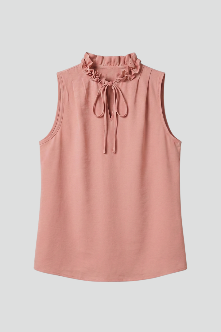 Women’s sleeveless top with ruffle V-neckline, button detail, and wide shoulders, suitable for casual wear and office outfits.