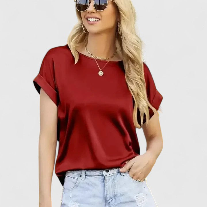 Women’s satin blouse with batwing sleeves and a relaxed fit, suitable for office outfits, casual wear, and evening styling.