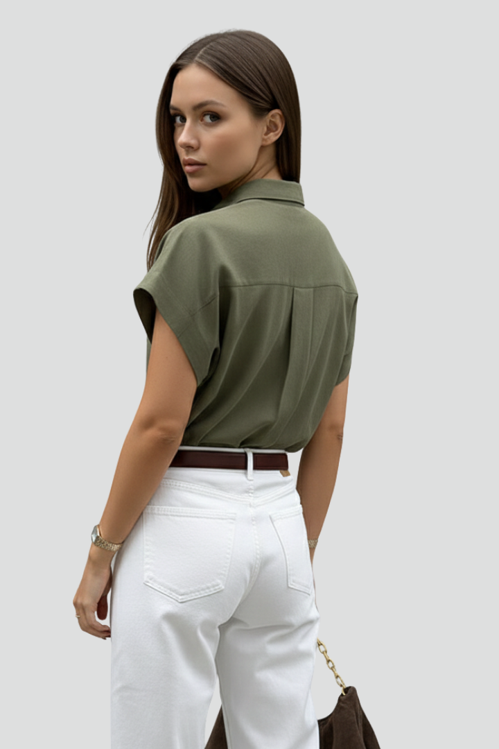 Women’s short sleeve shirt with pointed collar, button front, chest pocket, and straight hem for casual everyday styling.