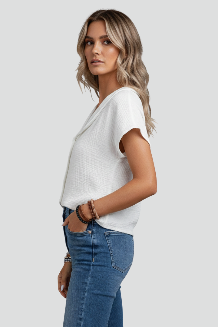 Women’s short sleeve blouse with wide collar and button front, featuring a textured surface for everyday and work outfits