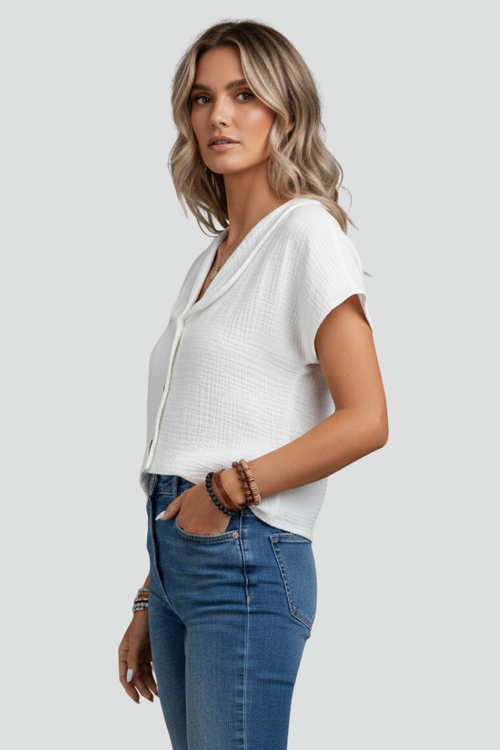 Women’s short sleeve blouse with wide collar and button front, featuring a textured surface for everyday and work outfits