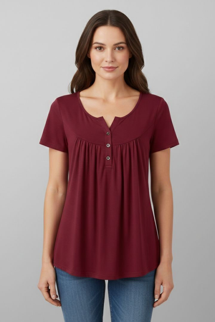 Women’s short sleeve blouse with V-neckline and front button detail, featuring a flared hem and clean finish for everyday wear and office styling.