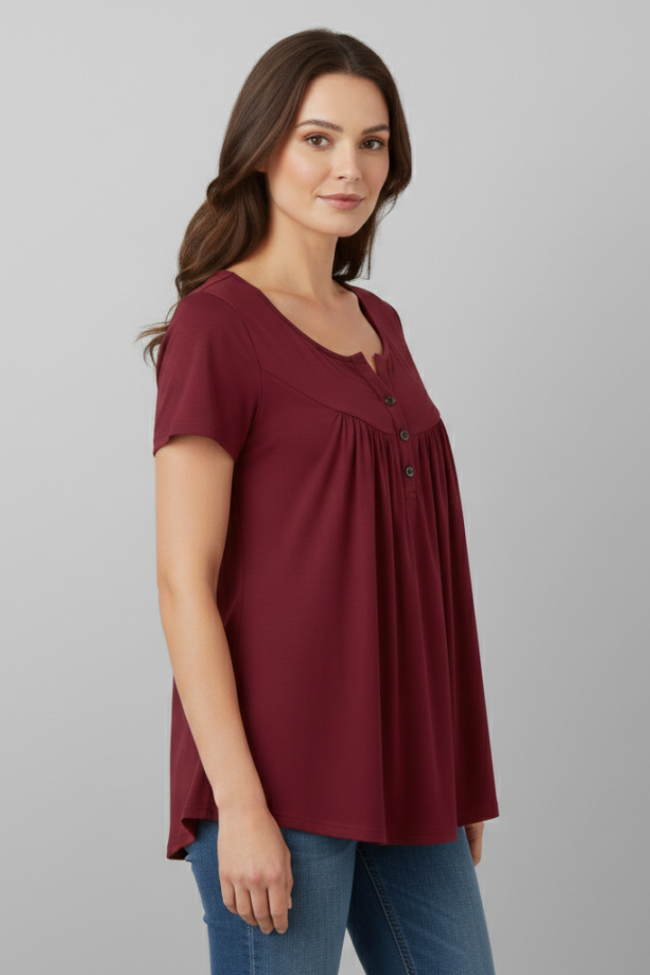 Women’s short sleeve blouse with V-neckline and front button detail, featuring a flared hem and clean finish for everyday wear and office styling.