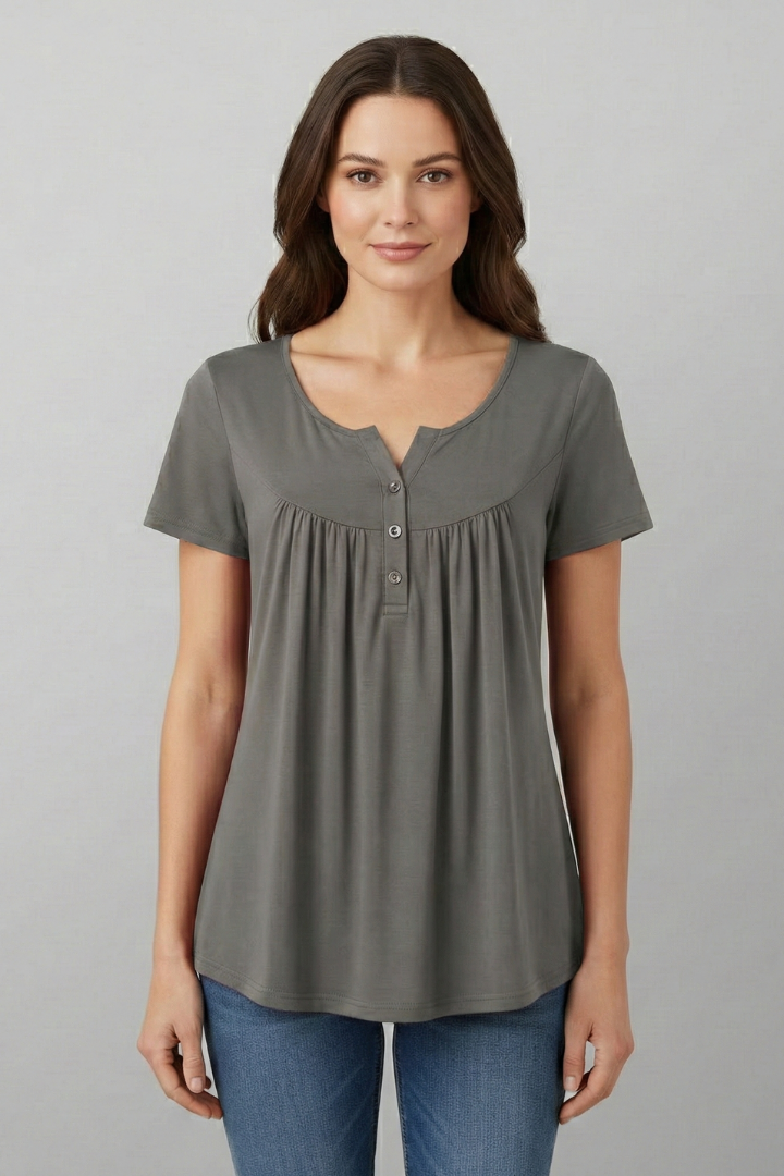 Women’s short sleeve blouse with V-neckline and front button detail, featuring a flared hem and clean finish for everyday wear and office styling.