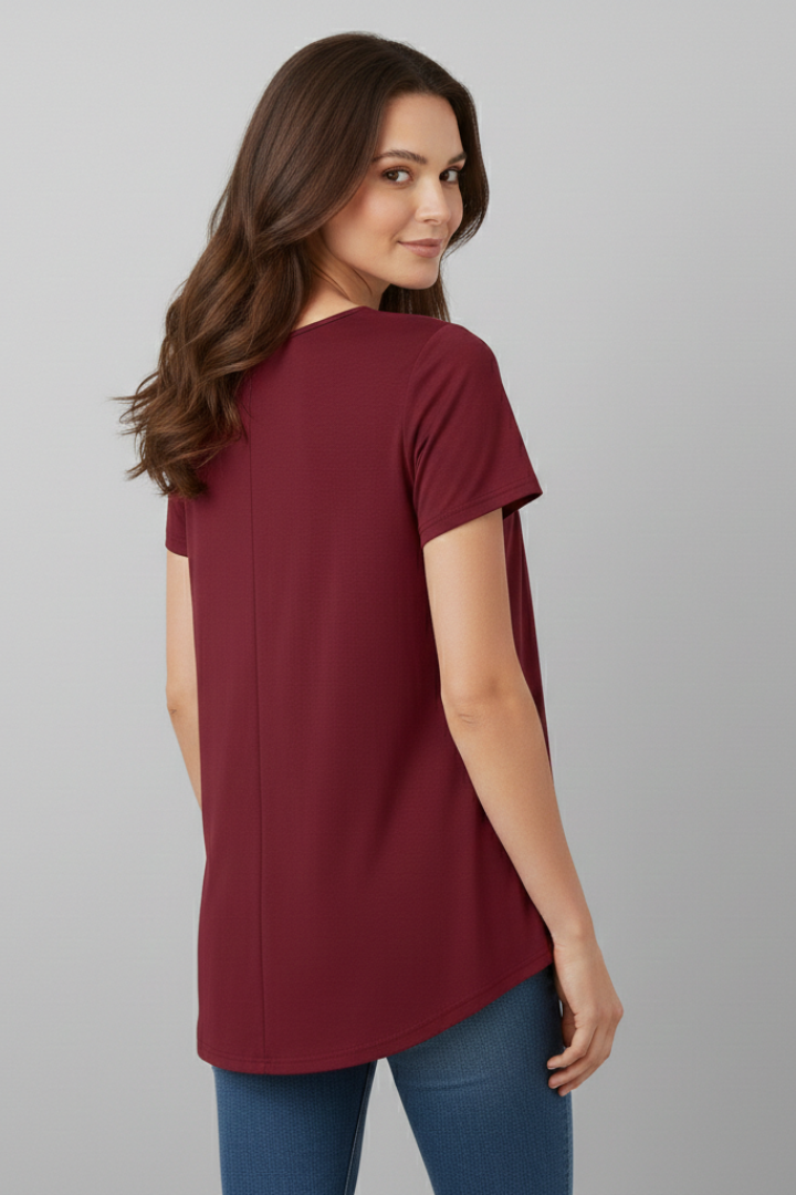 Women’s short sleeve blouse with V-neckline and front button detail, featuring a flared hem and clean finish for everyday wear and office styling.