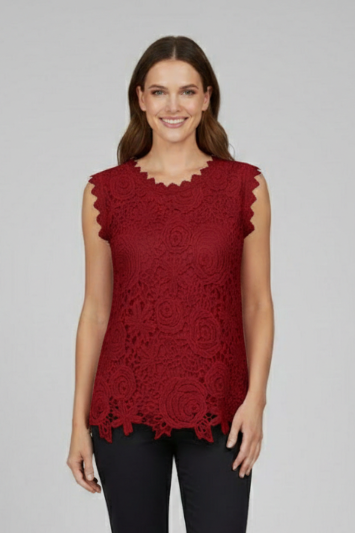 Women’s sleeveless blouse with V-neckline and textured lace-style surface, suitable for summer wear and everyday styling.