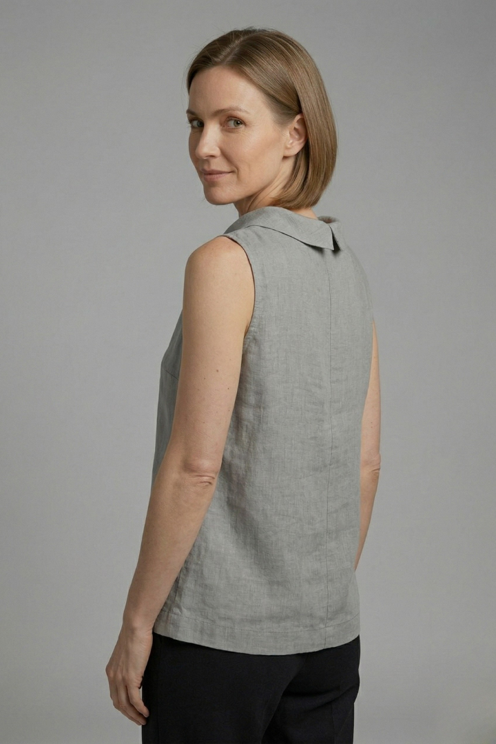 Women’s sleeveless top with roll neck and straight hem, ideal for casual outfits and smart everyday styling.