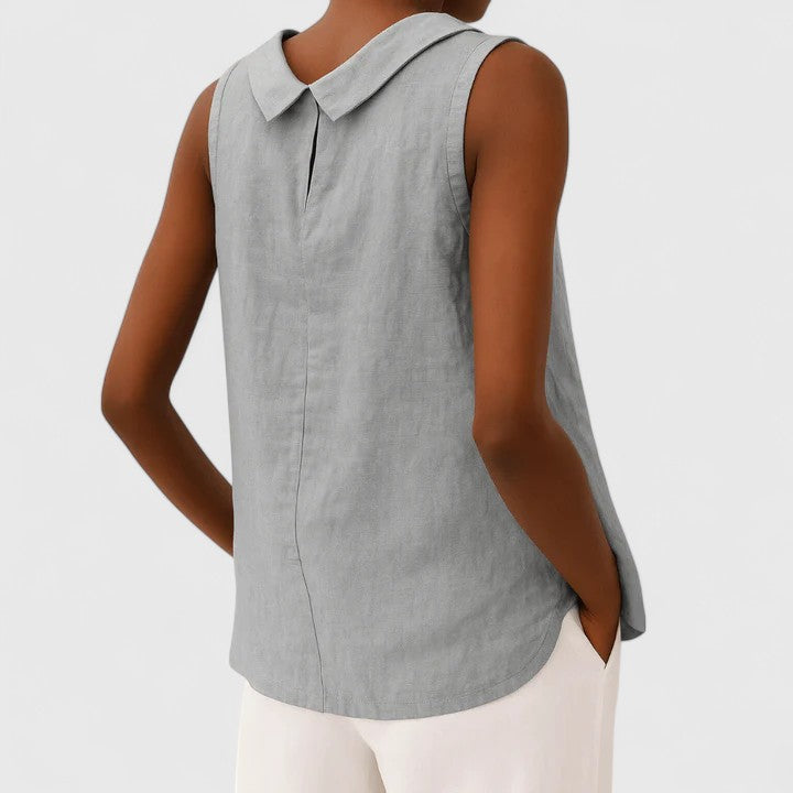Women’s sleeveless top with a roll collar, draped neckline, and relaxed fit, ideal for office wear, evening outings, and smart-casual styling.