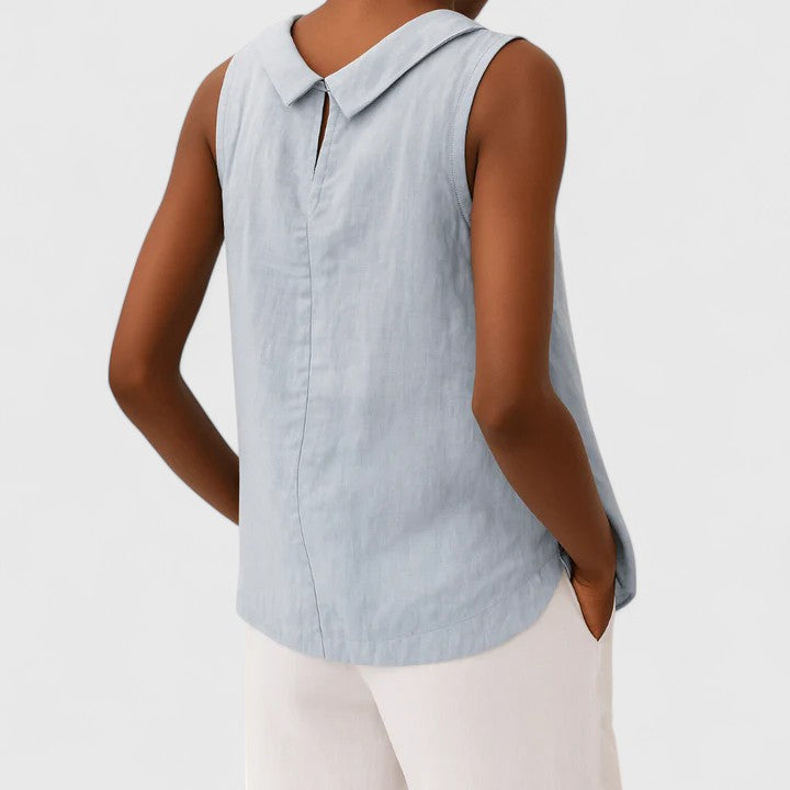 Women’s sleeveless top with a roll collar, draped neckline, and relaxed fit, ideal for office wear, evening outings, and smart-casual styling.