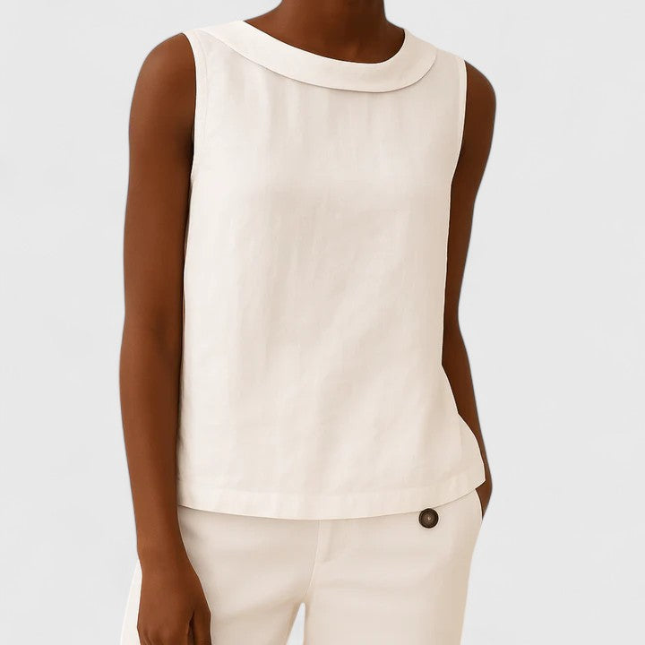 Women’s sleeveless top with a roll collar, draped neckline, and relaxed fit, ideal for office wear, evening outings, and smart-casual styling.