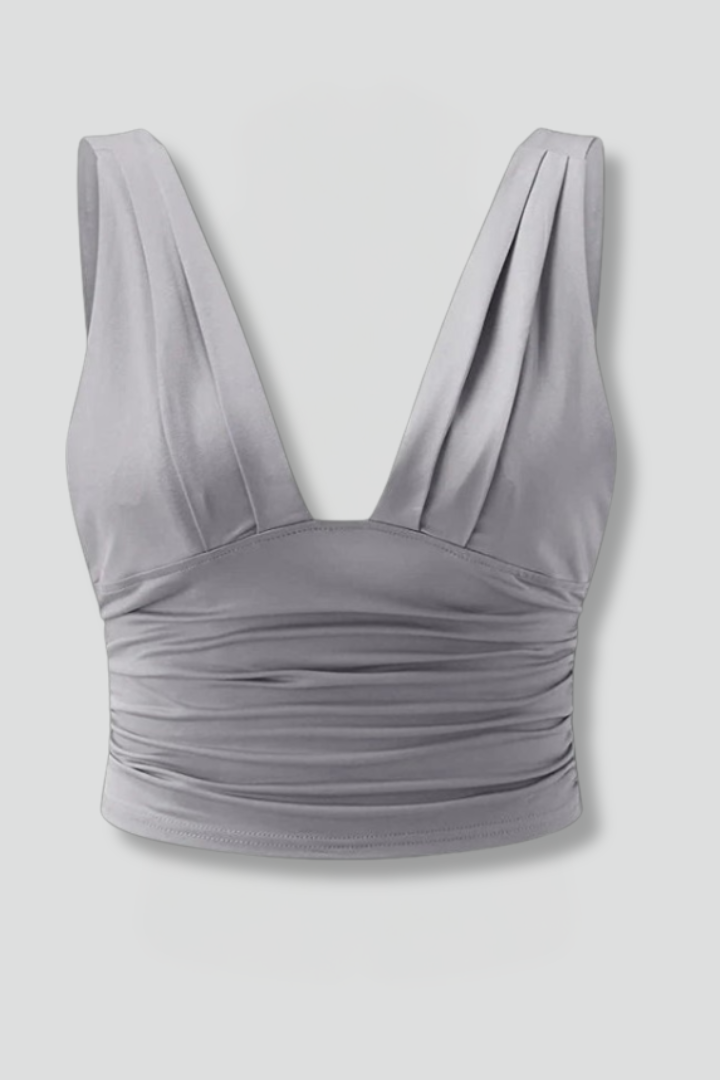 Women’s sleeveless top with V-neckline, lightweight pullover design, and straight hem for casual everyday styling.