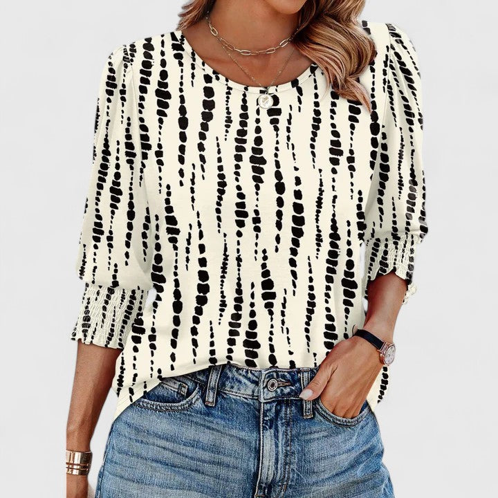 Women’s smocked top with a relaxed fit and lightweight design, ideal for casual outings, vacations, and everyday styling.