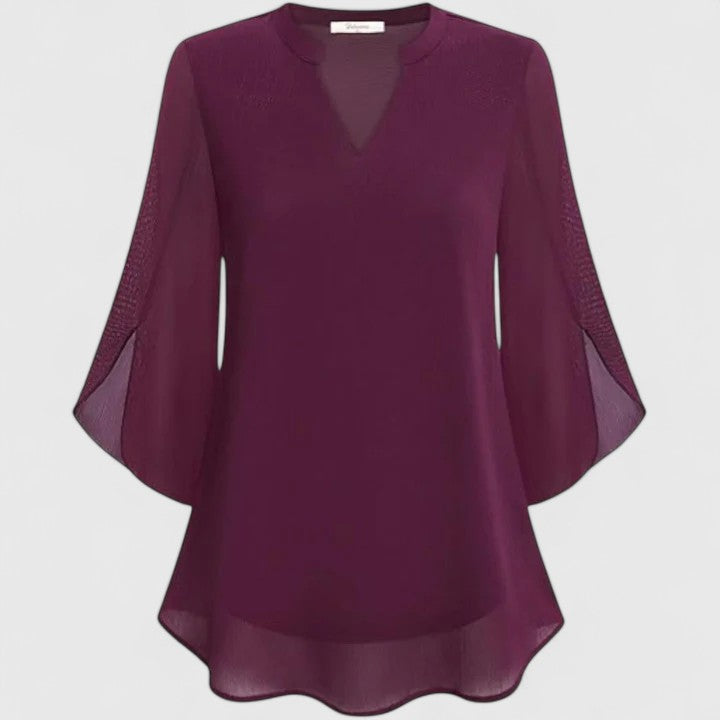 Women’s sophisticated blouse with relaxed fit and elegant silhouette, ideal for office wear, dinners, and casual everyday styling.