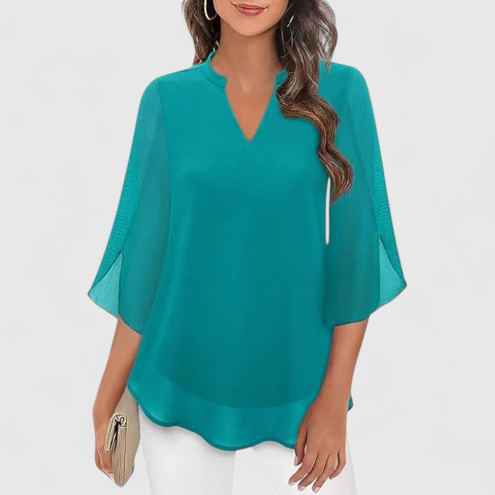Women’s sophisticated blouse with relaxed fit and elegant silhouette, ideal for office wear, dinners, and casual everyday styling.