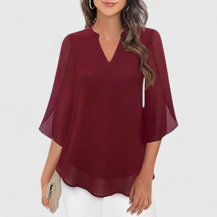 Women’s sophisticated blouse with relaxed fit and elegant silhouette, ideal for office wear, dinners, and casual everyday styling.