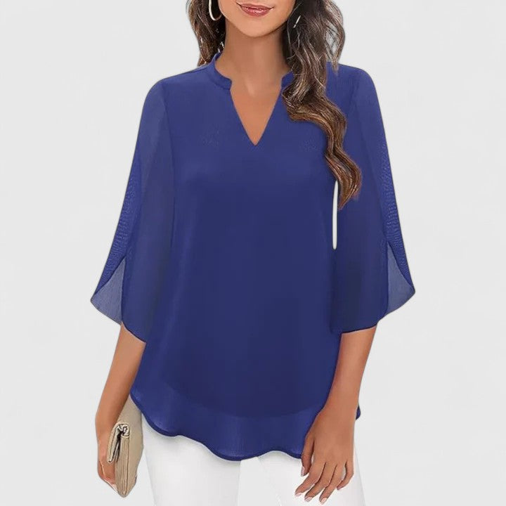 Women’s sophisticated blouse with relaxed fit and elegant silhouette, ideal for office wear, dinners, and casual everyday styling.