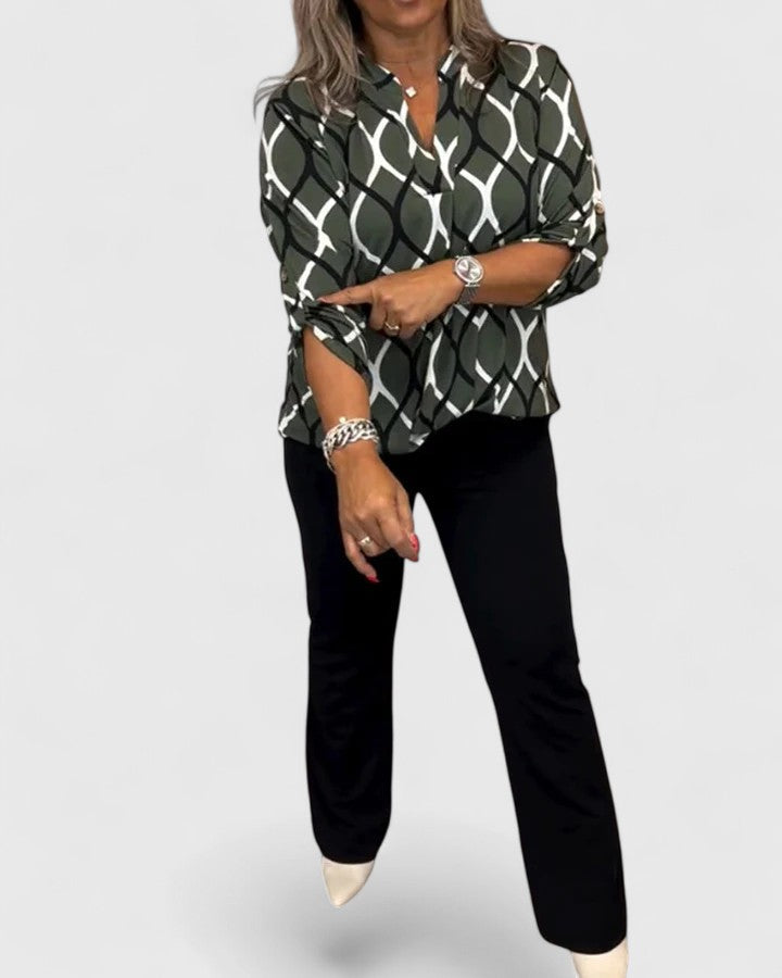 Women’s sophisticated blouse with elegant detailing and a relaxed fit, suitable for office outfits, casual wear, and smart occasions.
