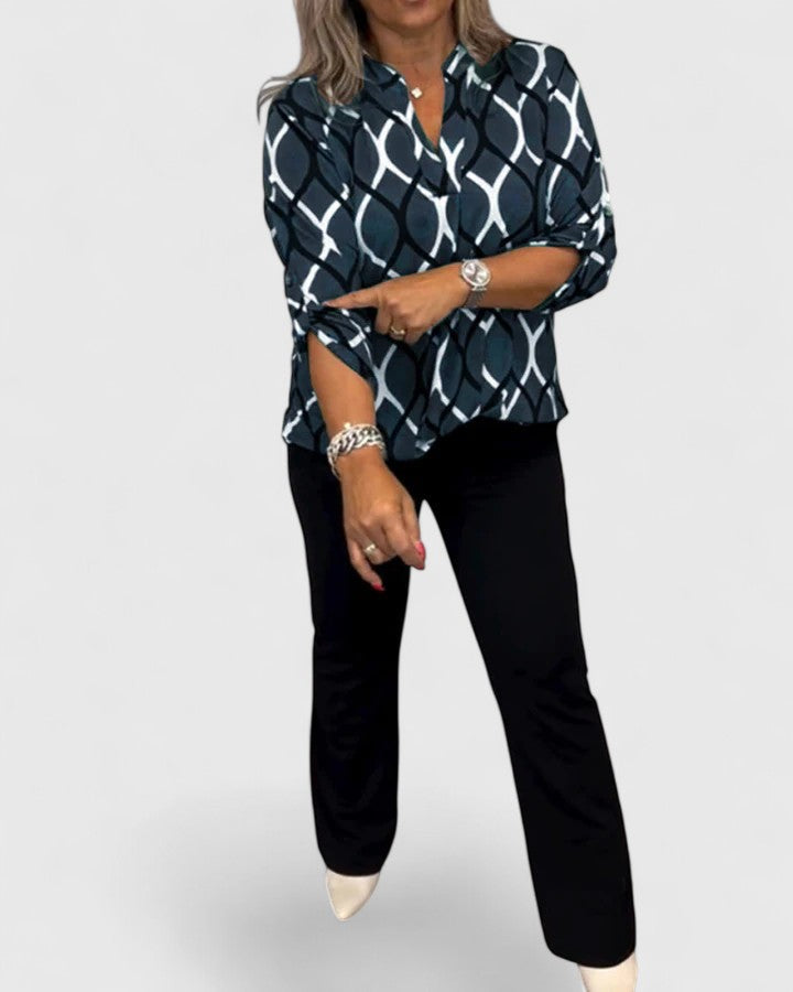Women’s sophisticated blouse with elegant detailing and a relaxed fit, suitable for office outfits, casual wear, and smart occasions.