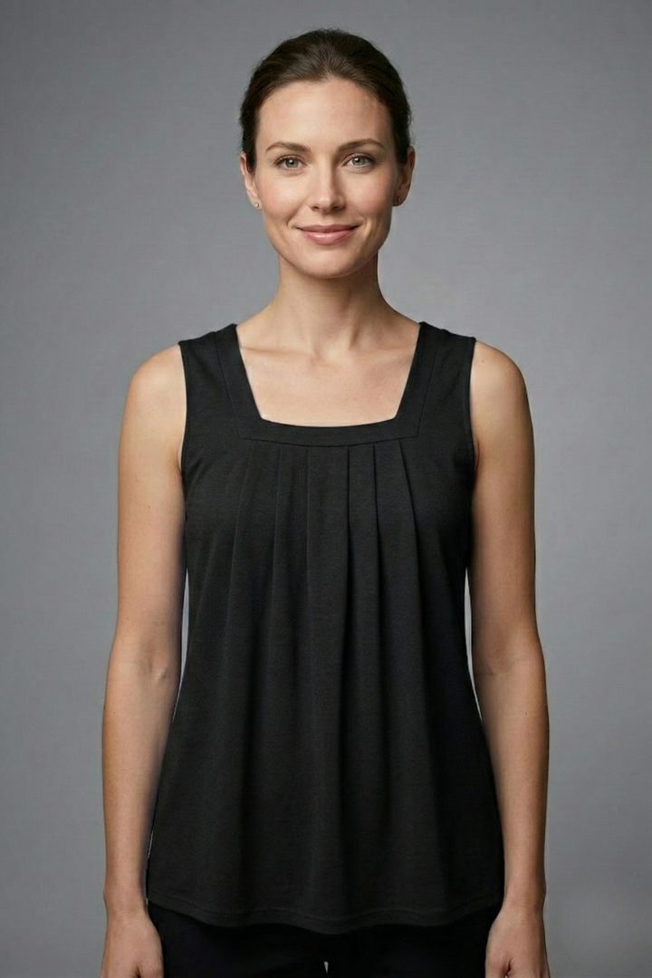 Women’s sleeveless blouse with square neckline, wide straps, rounded hem, and printed pattern, suitable for casual wear and summer outfits.