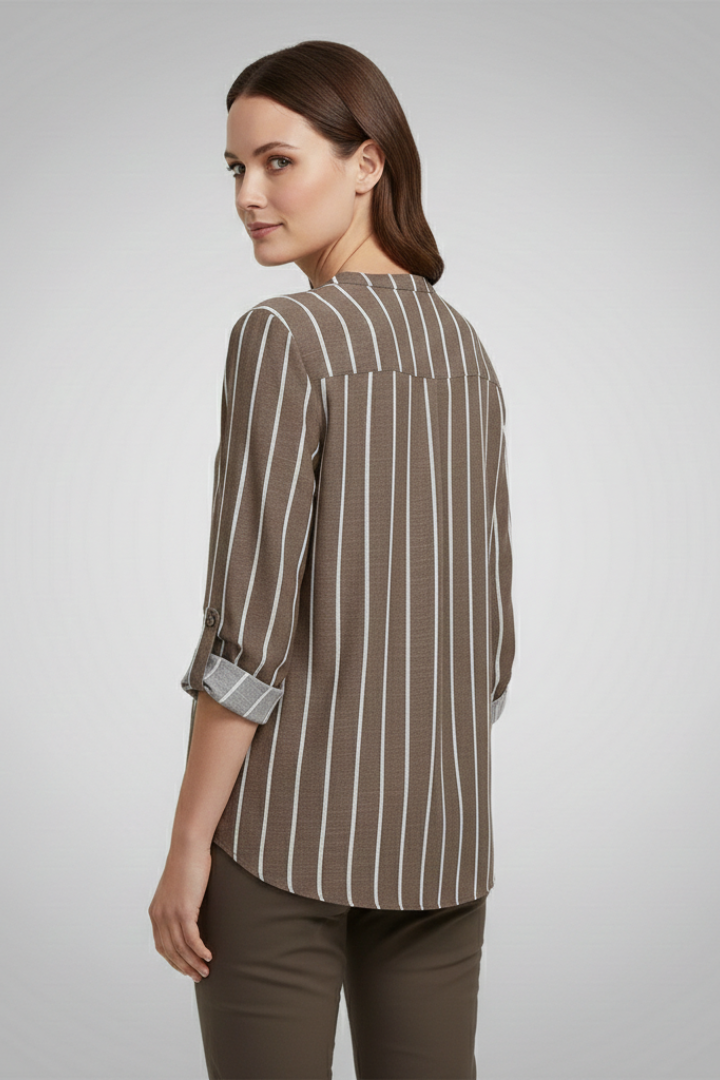 Women’s striped blouse with V-neckline and full button front, featuring roll-up sleeves and a curved hem for office or casual wear.