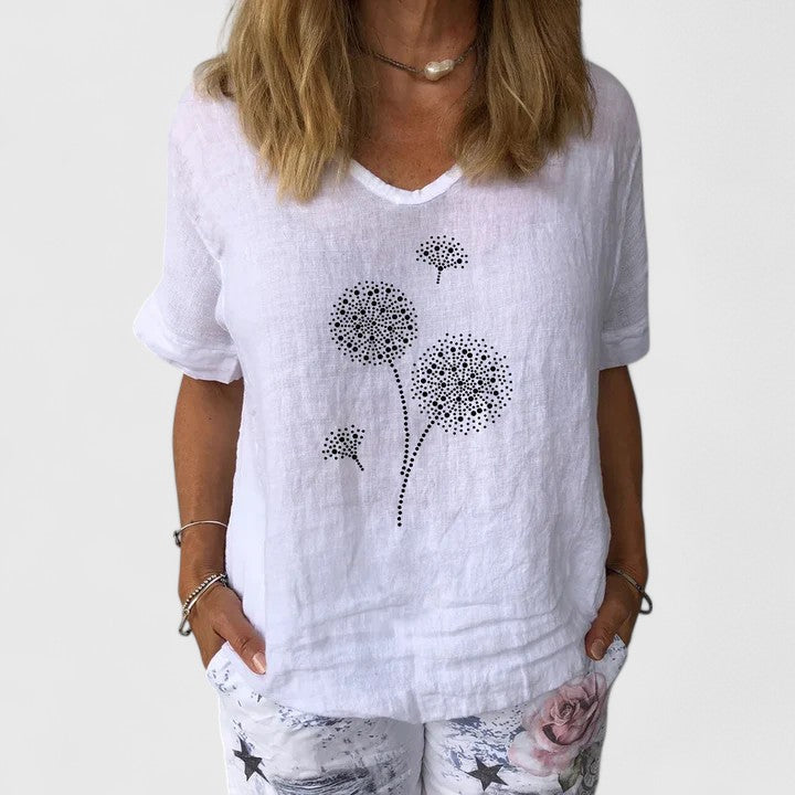 Women’s summer blouse with a loose fit and print design, suitable for casual outfits, travel wear, and warm-weather styling.
