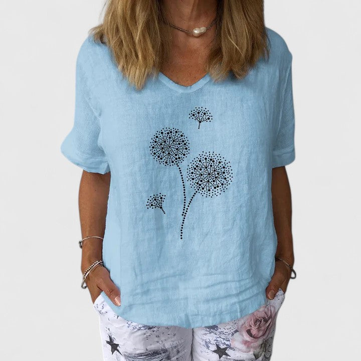 Women’s summer blouse with a loose fit and print design, suitable for casual outfits, travel wear, and warm-weather styling.