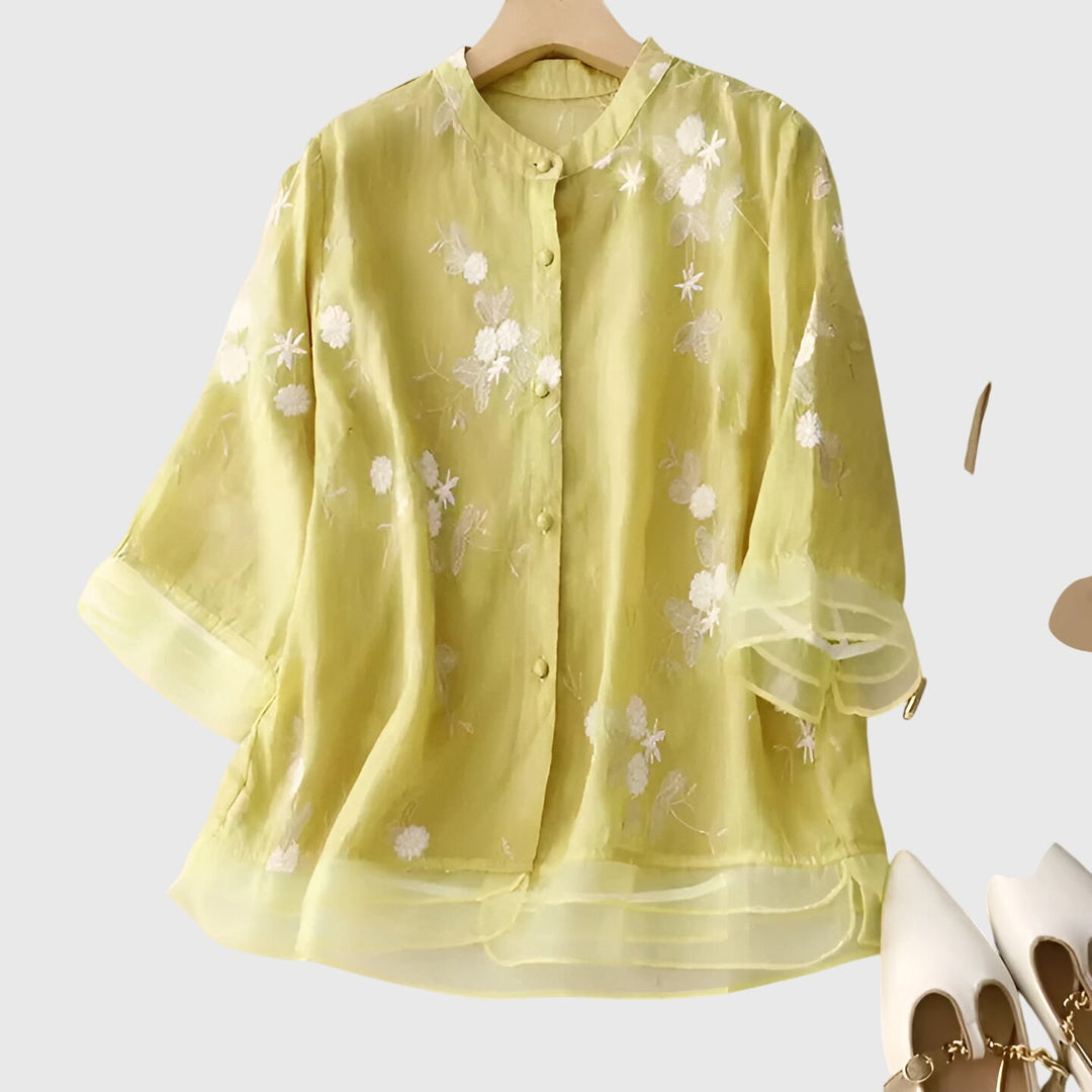Women’s top with floral embroidery and a relaxed fit, ideal for casual outings, smart-casual occasions, and everyday styling.