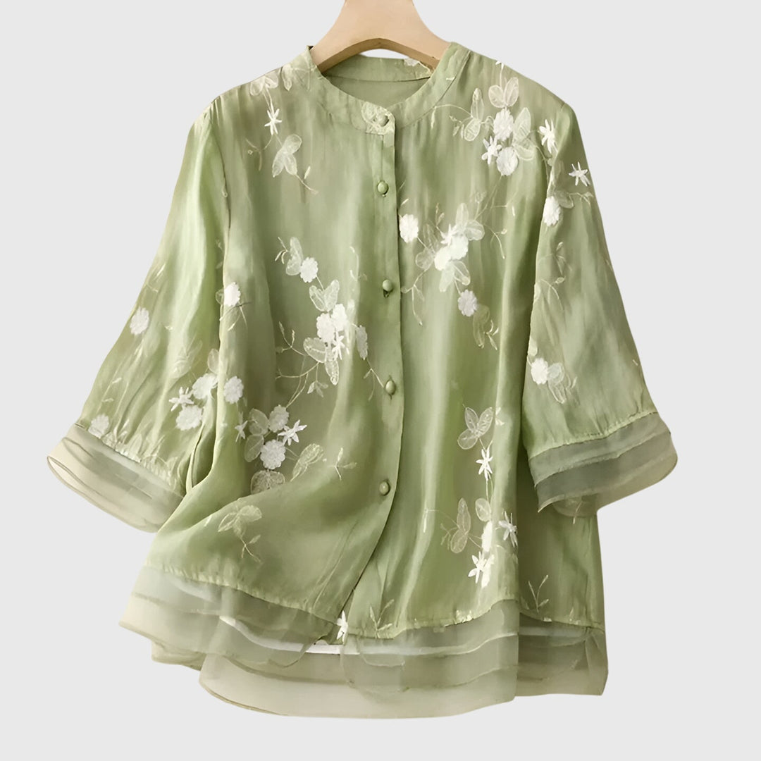 Women’s top with floral embroidery and a relaxed fit, ideal for casual outings, smart-casual occasions, and everyday styling.
