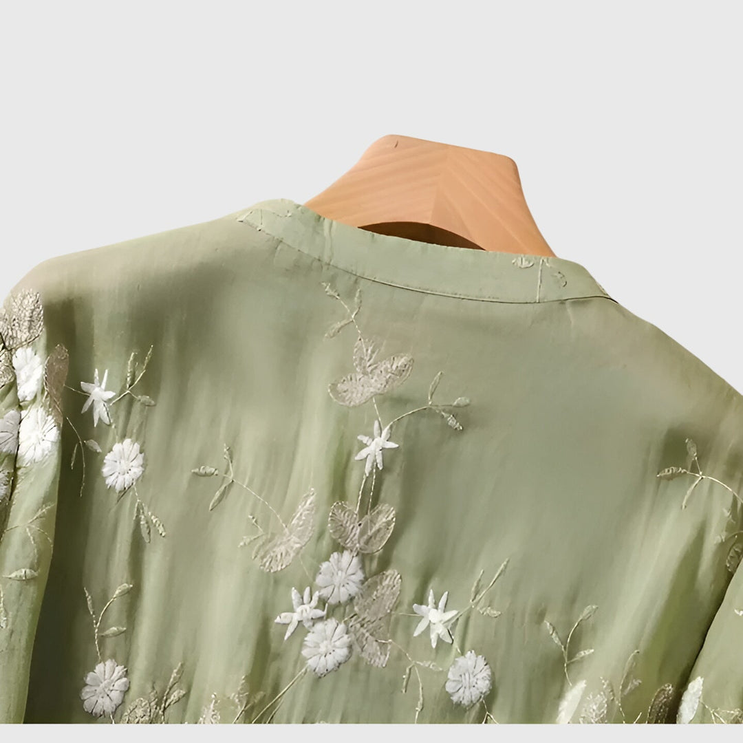 Women’s top with floral embroidery and a relaxed fit, ideal for casual outings, smart-casual occasions, and everyday styling.