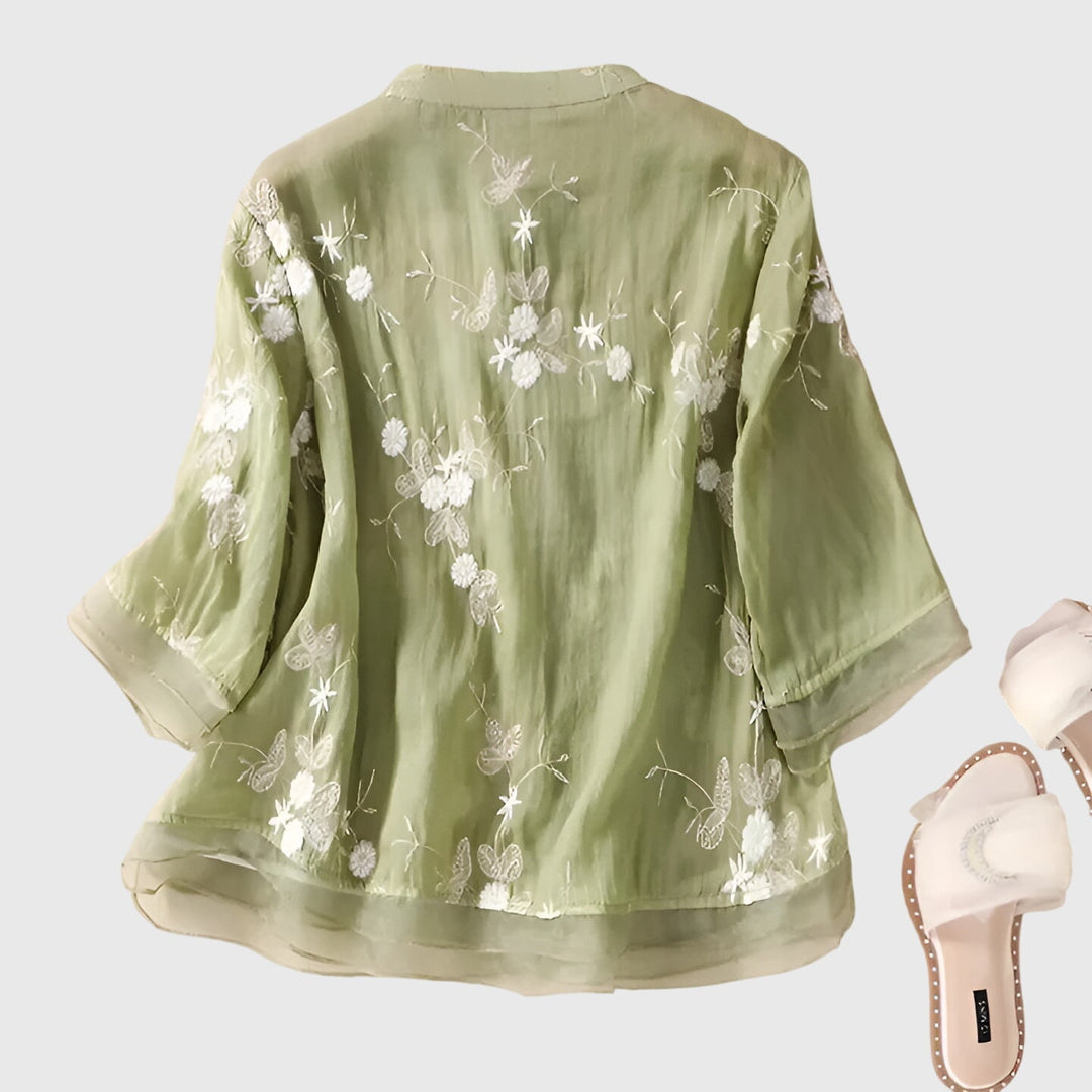 Women’s top with floral embroidery and a relaxed fit, ideal for casual outings, smart-casual occasions, and everyday styling.