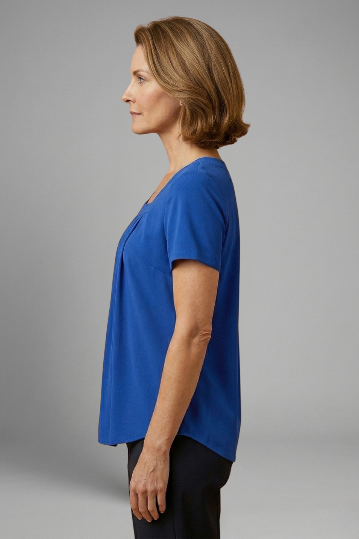 Women’s tunic top with square neckline, pleated front detail, loose fit, and hip-length hem for casual everyday styling.