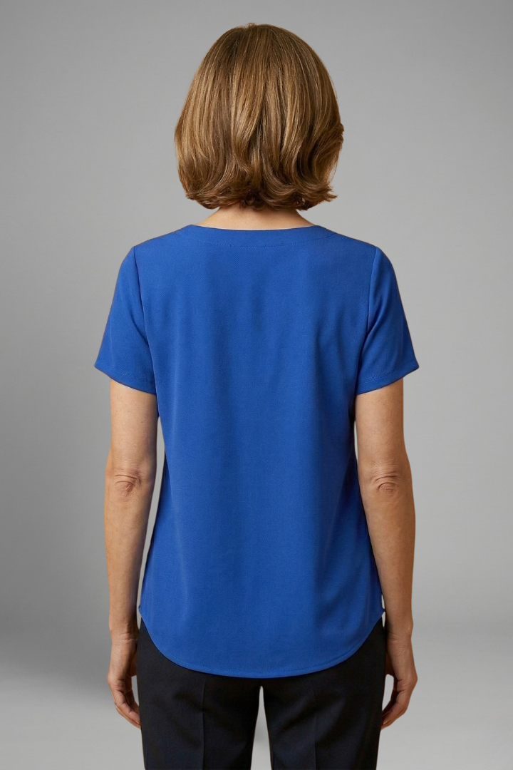 Women’s tunic top with square neckline, pleated front detail, loose fit, and hip-length hem for casual everyday styling.