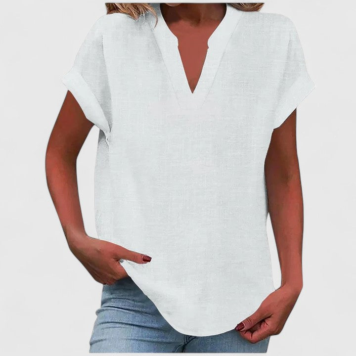 Women’s V-neck blouse with rolled short sleeves and relaxed fit, ideal for smart-casual outfits and everyday styling.
