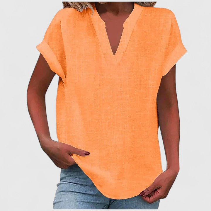 Women’s V-neck blouse with rolled short sleeves and relaxed fit, ideal for smart-casual outfits and everyday styling.