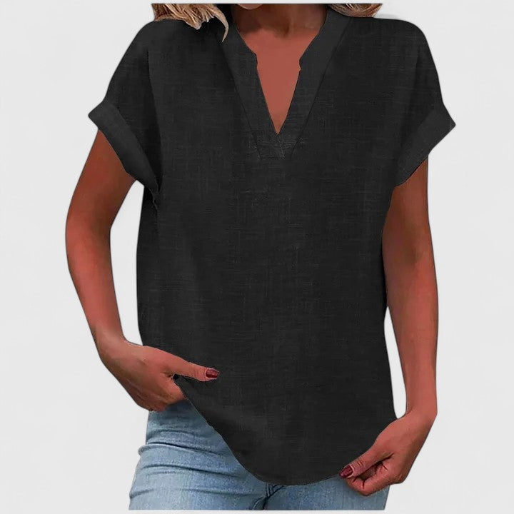 Women’s V-neck blouse with rolled short sleeves and relaxed fit, ideal for smart-casual outfits and everyday styling.
