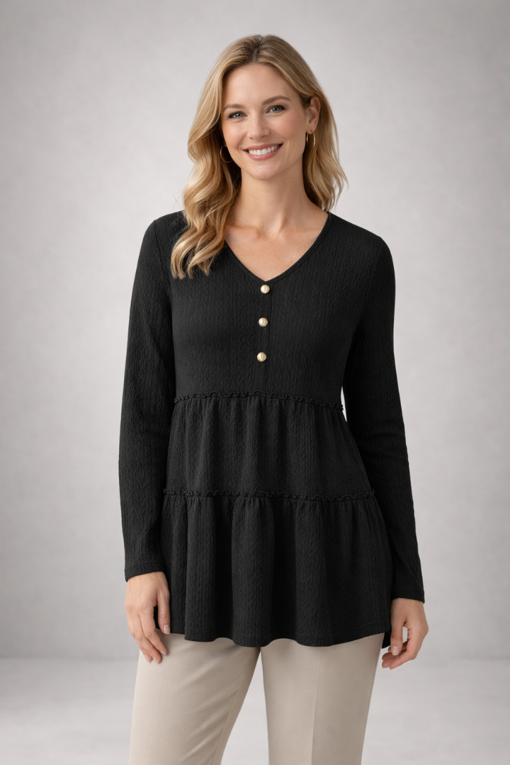 Women’s long sleeve top with v-neckline and tiered hem, featuring a textured surface for casual wear and office outfits