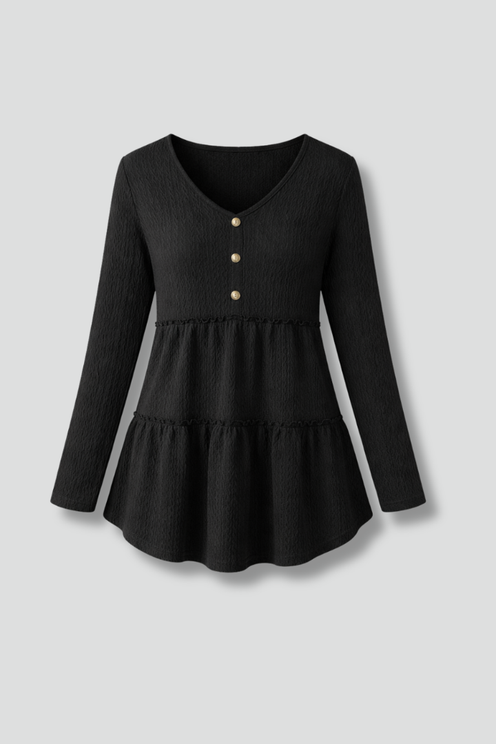 Women’s long sleeve top with v-neckline and tiered hem, featuring a textured surface for casual wear and office outfits