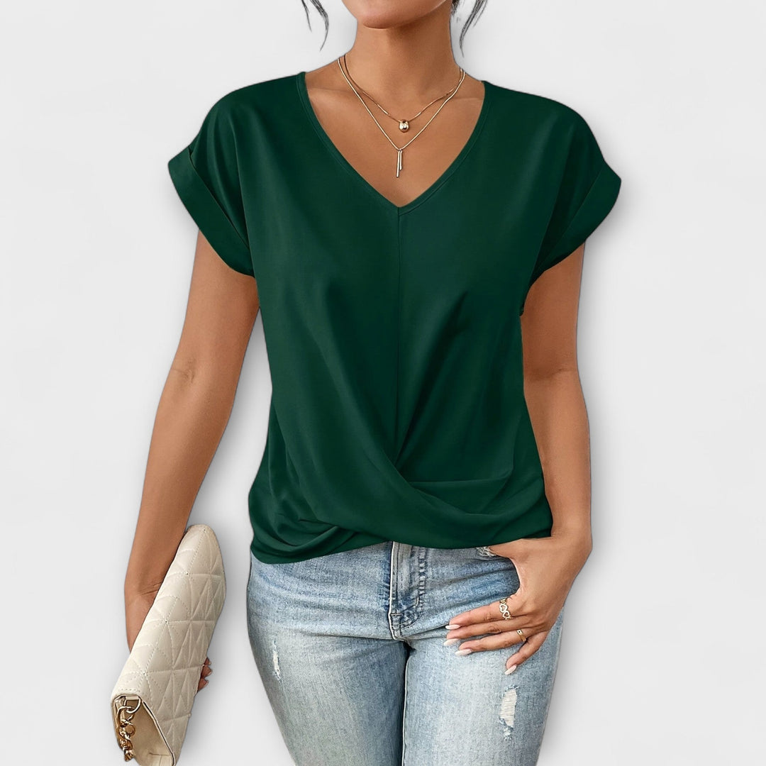 Women’s V-neck top with button detail and a flattering fit, ideal for office wear, casual outings, and smart-casual styling.