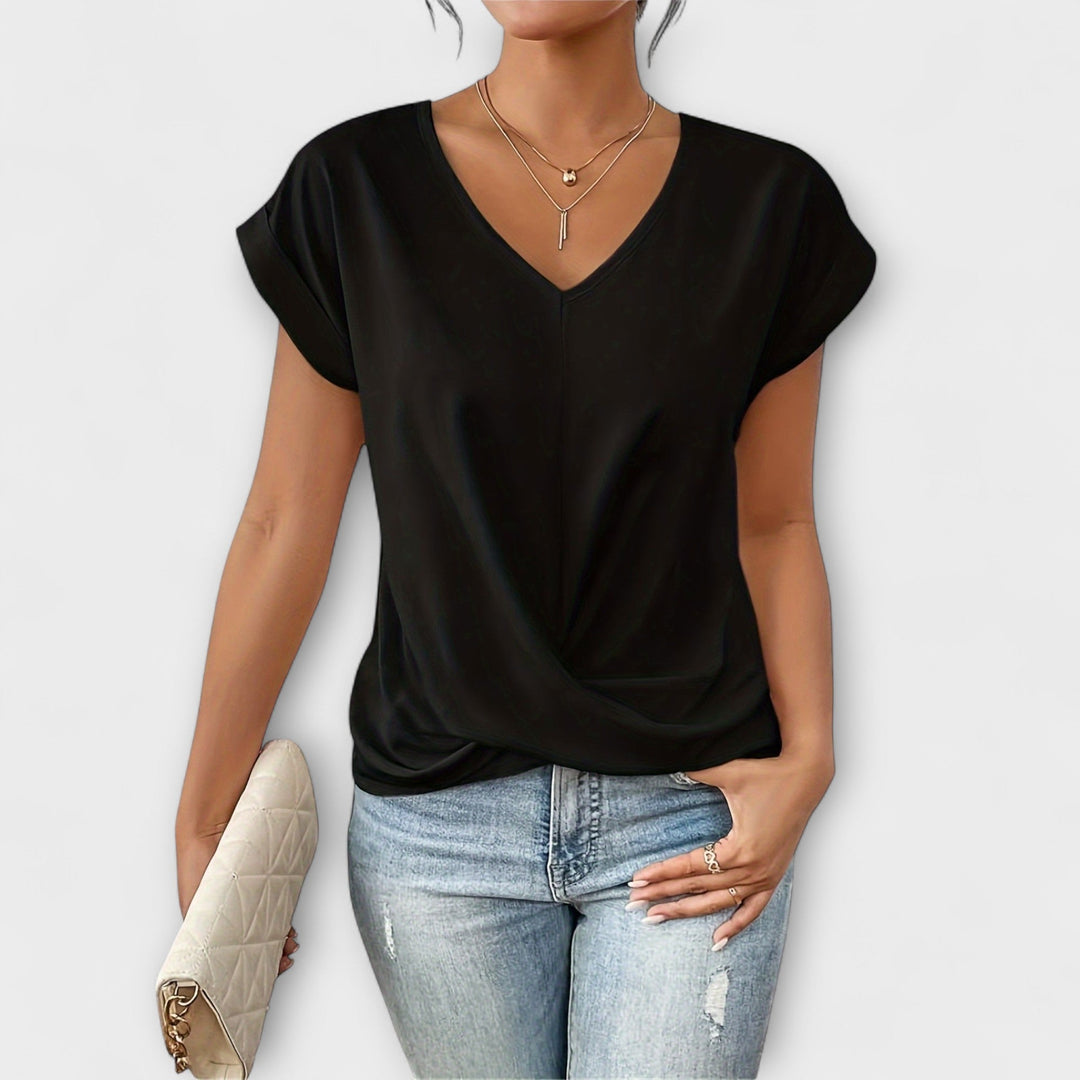 Women’s V-neck top with button detail and a flattering fit, ideal for office wear, casual outings, and smart-casual styling.