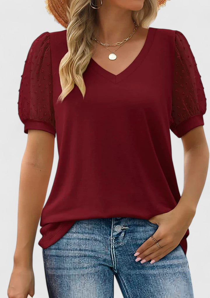 Women’s V-neck top with sheer sleeves and a flattering fit, ideal for casual wear, office outfits, and evening occasions.