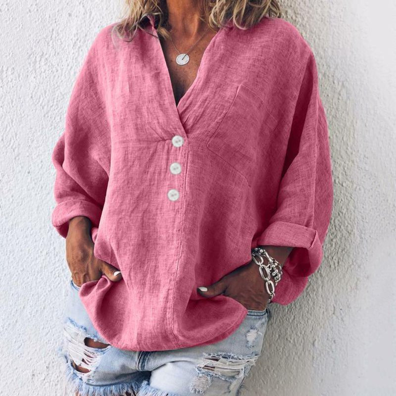 Women’s blouse with V-neckline, roll-tab sleeves, button-front closure, and relaxed oversized fit, suitable for office wear and everyday styling.