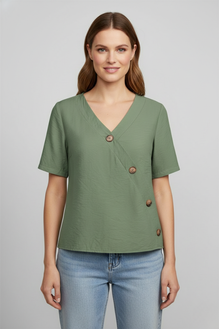 Women’s wrap style blouse with V-neckline and button accents, featuring short sleeves and a straight hem for office or everyday wear.
