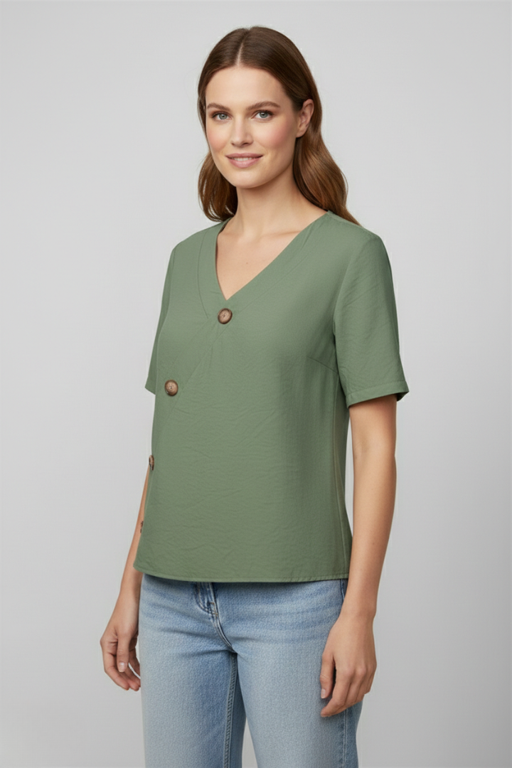 Women’s wrap style blouse with V-neckline and button accents, featuring short sleeves and a straight hem for office or everyday wear.