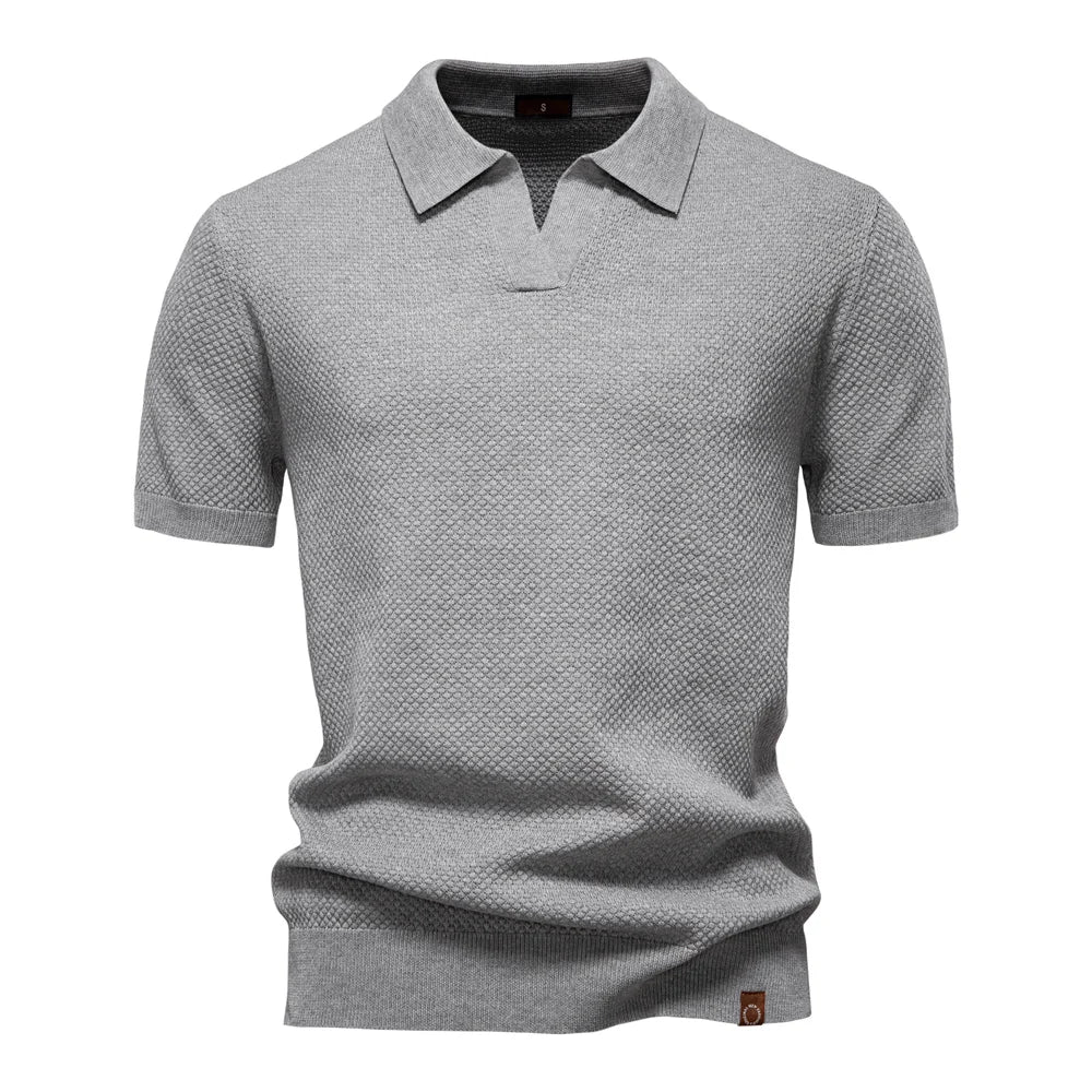 Men’s polo shirt with a structured collar, short sleeves, and tailored fit, ideal for summer days, casual outings, and smart-casual wear.