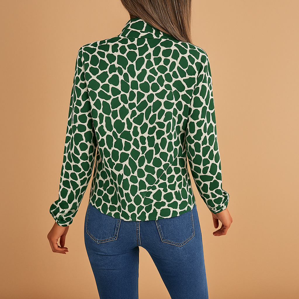 Women’s green polka dot blouse with bow detail and elastic cuffs, ideal for office wear, business meetings, and smart casual outfits.