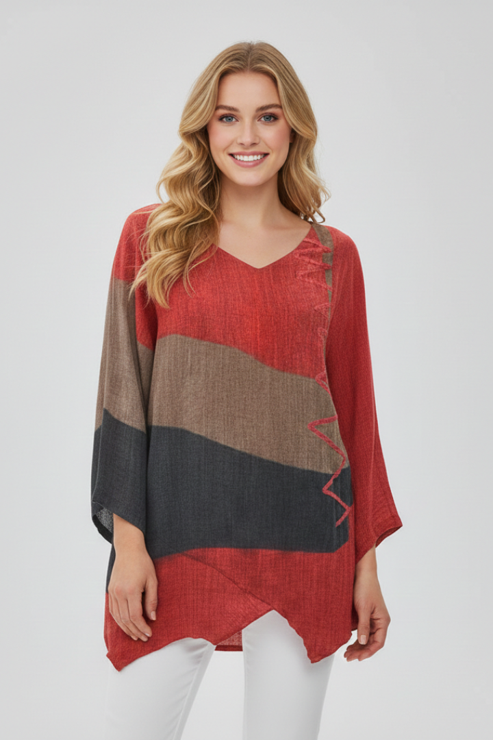 Women’s printed V-neck top with loose fit, wide short sleeves, and asymmetrical hem with side slits, suitable for summer and casual outfits.