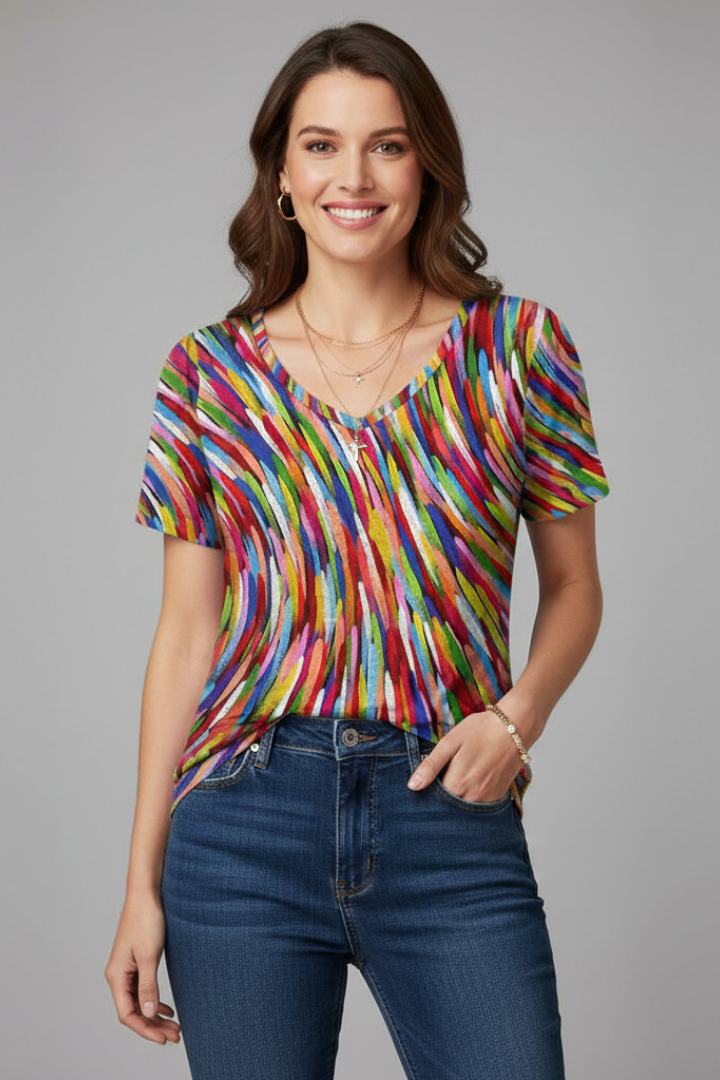 Women’s printed V-neck T-shirt with short sleeves, loose fit, curved hem, and all-over pattern, suitable for casual wear and summer outfits.