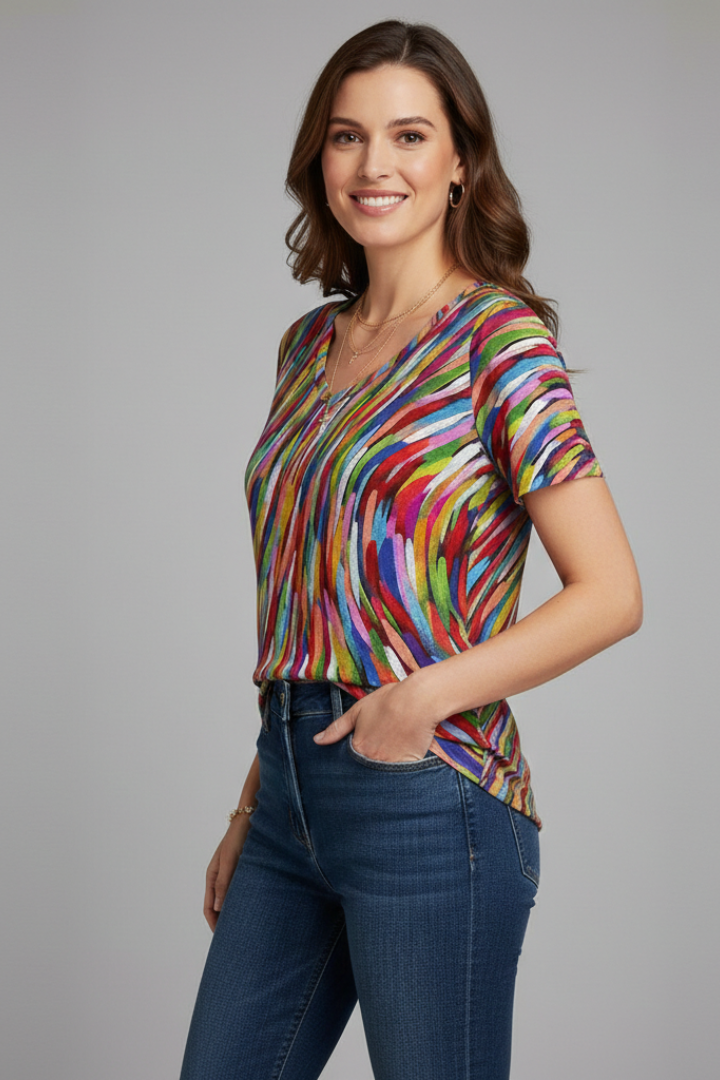 Women’s printed V-neck T-shirt with short sleeves, loose fit, curved hem, and all-over pattern, suitable for casual wear and summer outfits.