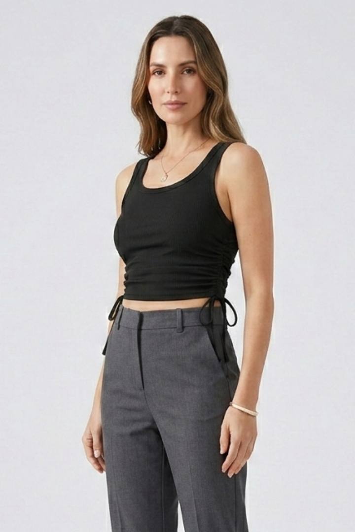 Women’s crop top with side ruching, round neckline, and ribbed texture, designed for casual wear and summer outfits
