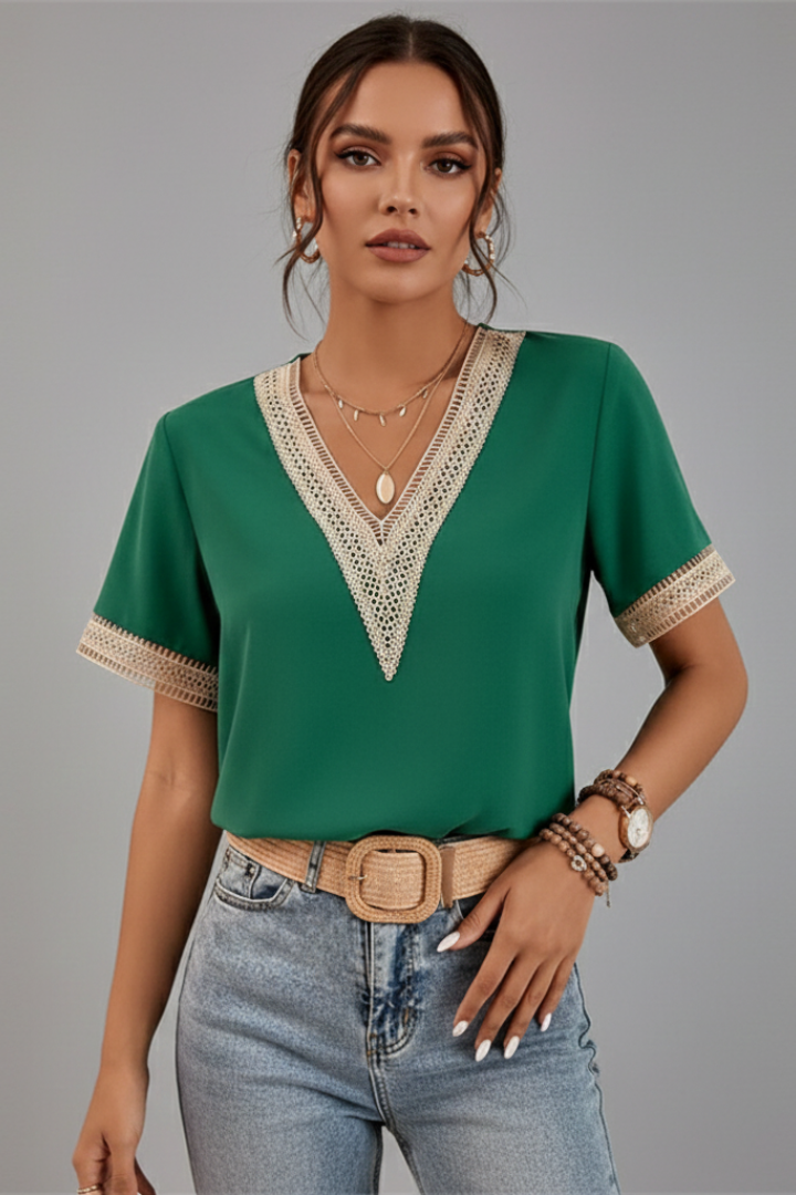 Women’s V-neck blouse with decorative trim, short sleeves, and straight fit, suitable for everyday wear and office outfits.